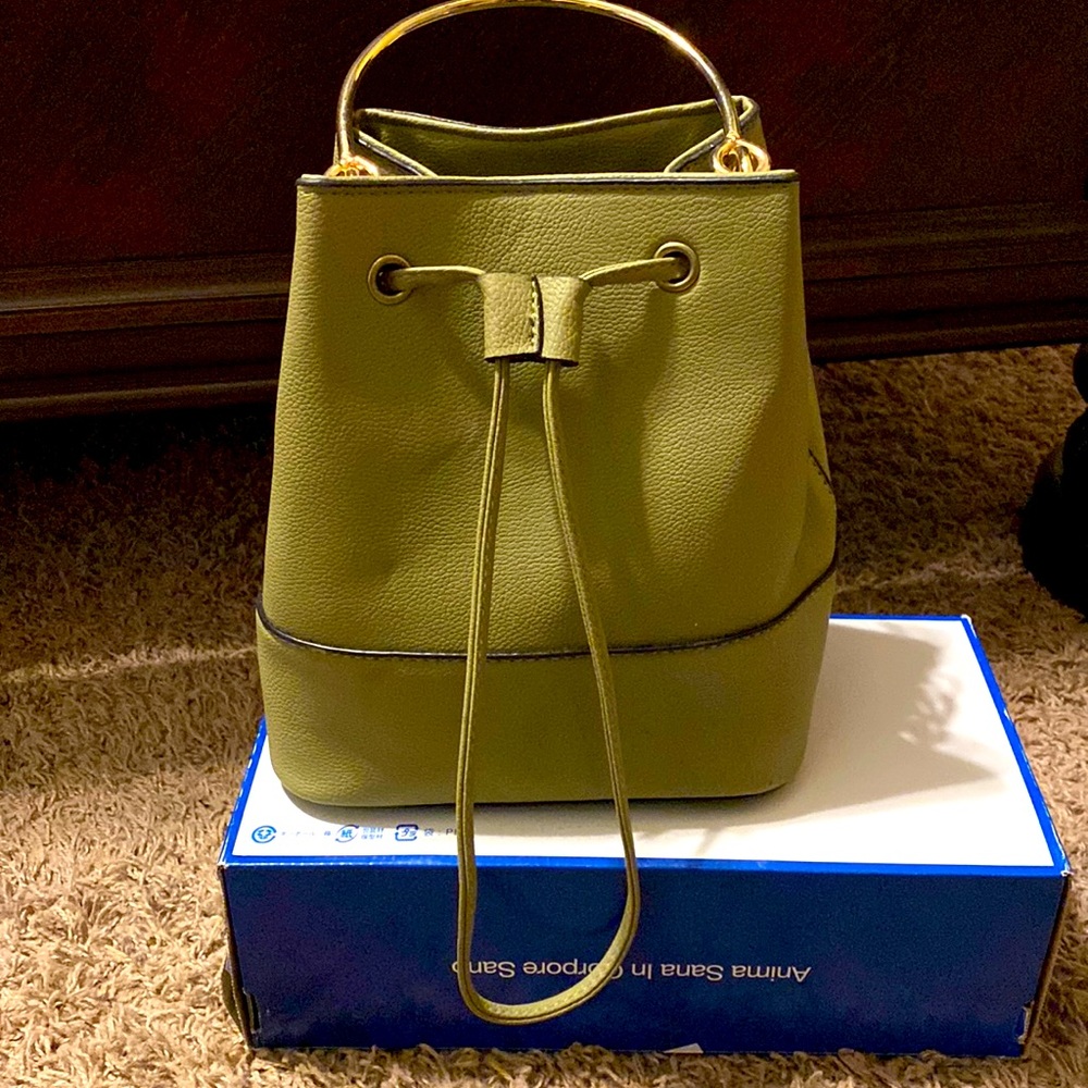 Green drawstring hand purse